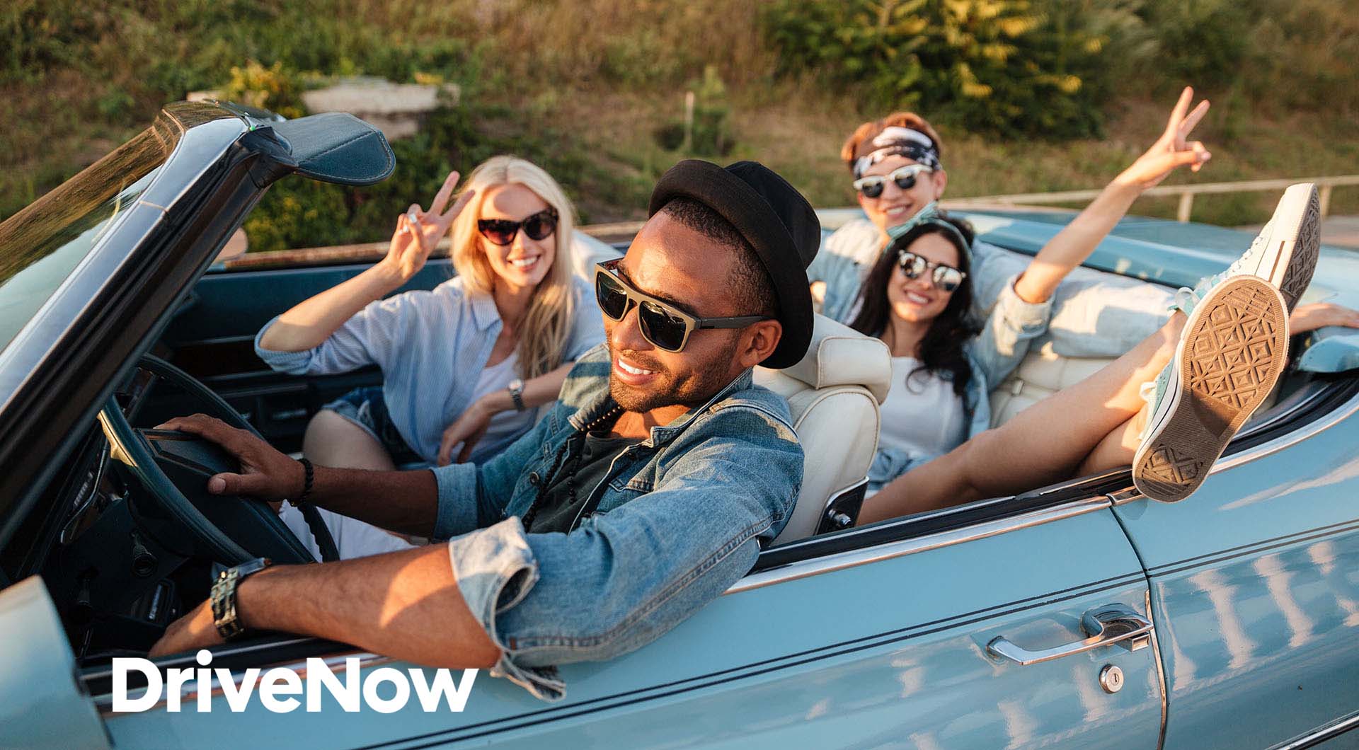 Image:friends having fun in a car purchased from DriveNow Auto Sales