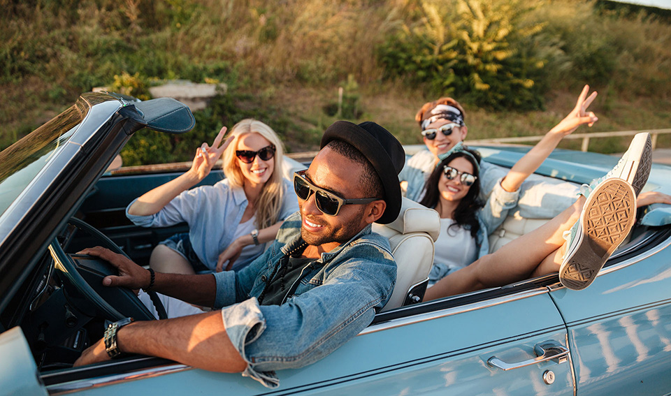 Image:friends having fun in a car purchased from DriveNow Auto Sales