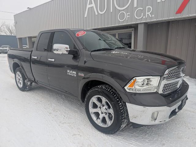 2015 RAM 1500 4WD Quad Cab 140.5" Laramie