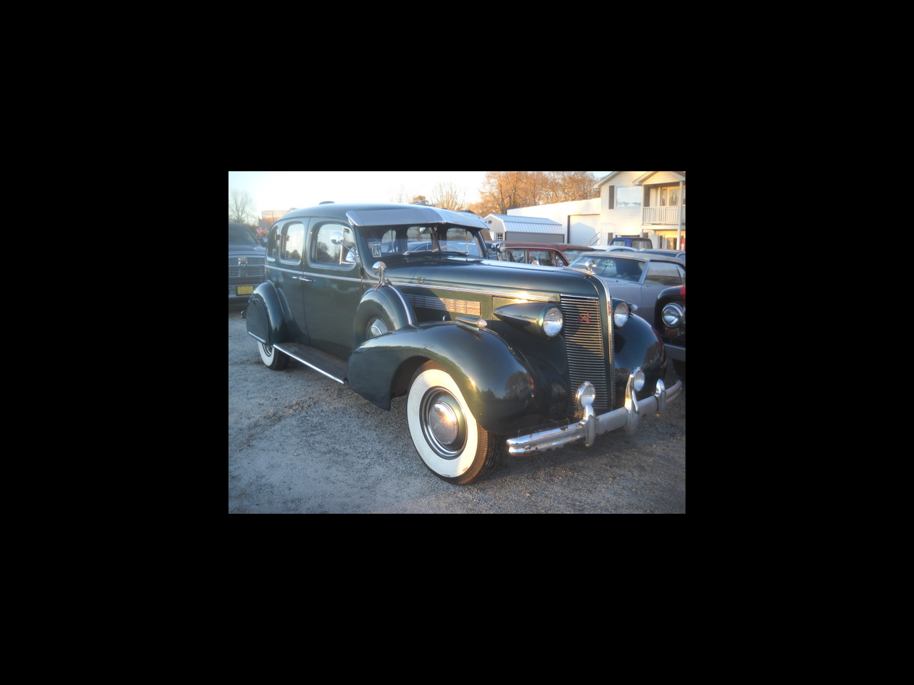 1937 Buick Roadmaster 4 door sedan with twin sidemounts