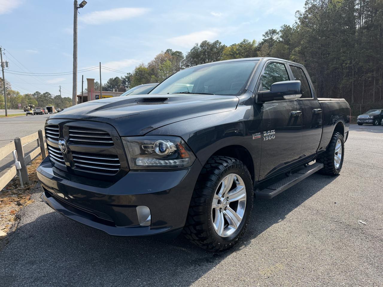 2014 RAM 1500 4WD Quad Cab 140.5" Sport