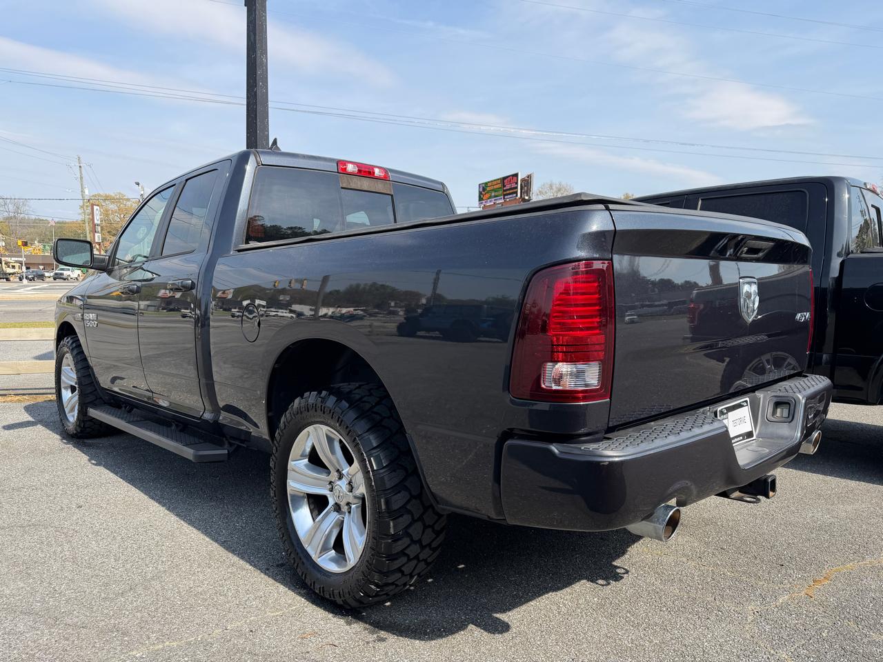 RAM 1500 4WD Quad Cab 140.5" Sport 2014