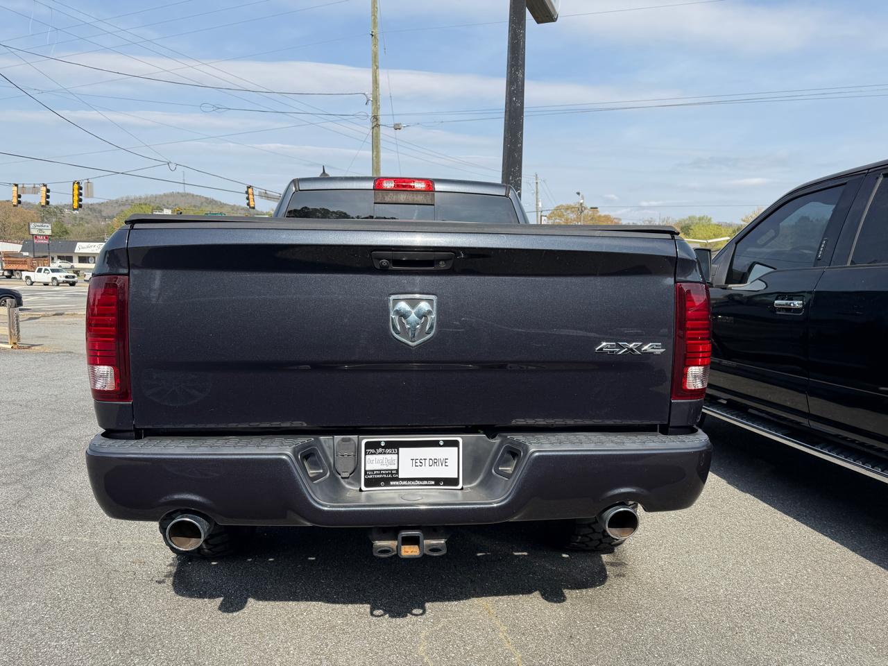 RAM 1500 4WD Quad Cab 140.5" Sport 2014
