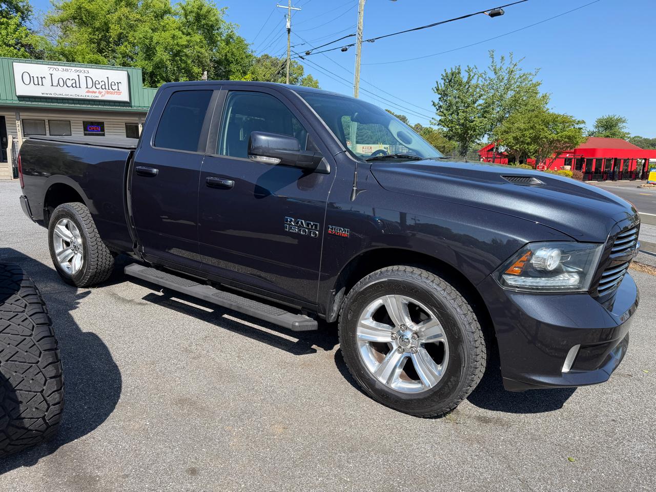 RAM 1500 4WD Quad Cab 140.5" Sport 2014