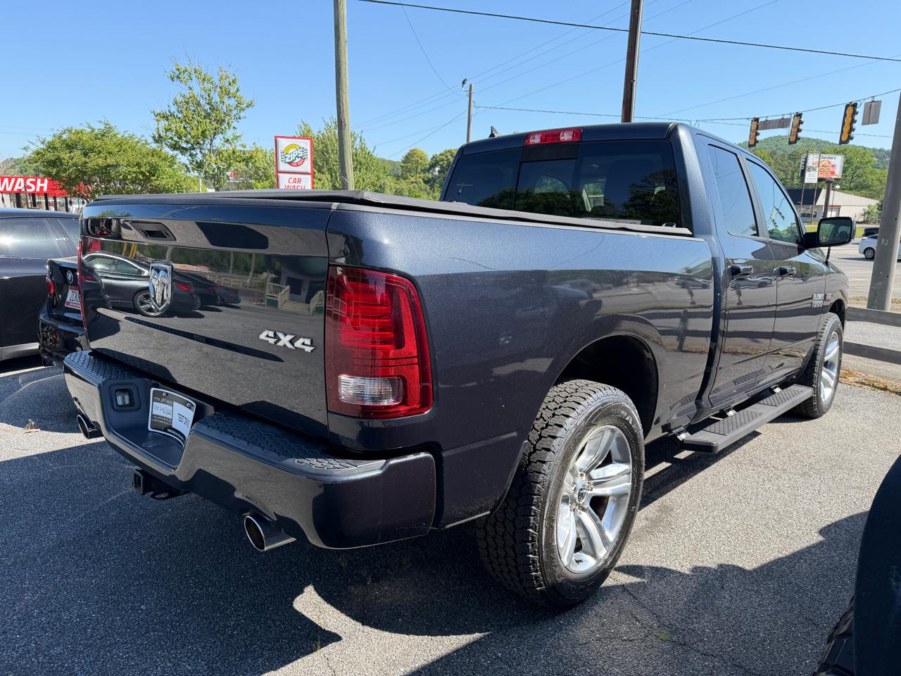 RAM 1500 4WD Quad Cab 140.5" Sport 2014