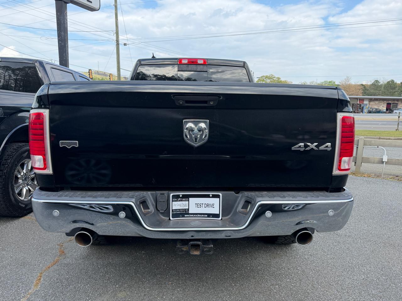 RAM 1500 4WD Quad Cab 140.5" Laramie 2014