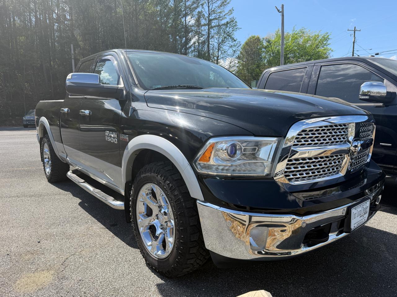 2014 RAM 1500 4WD Quad Cab 140.5" Laramie
