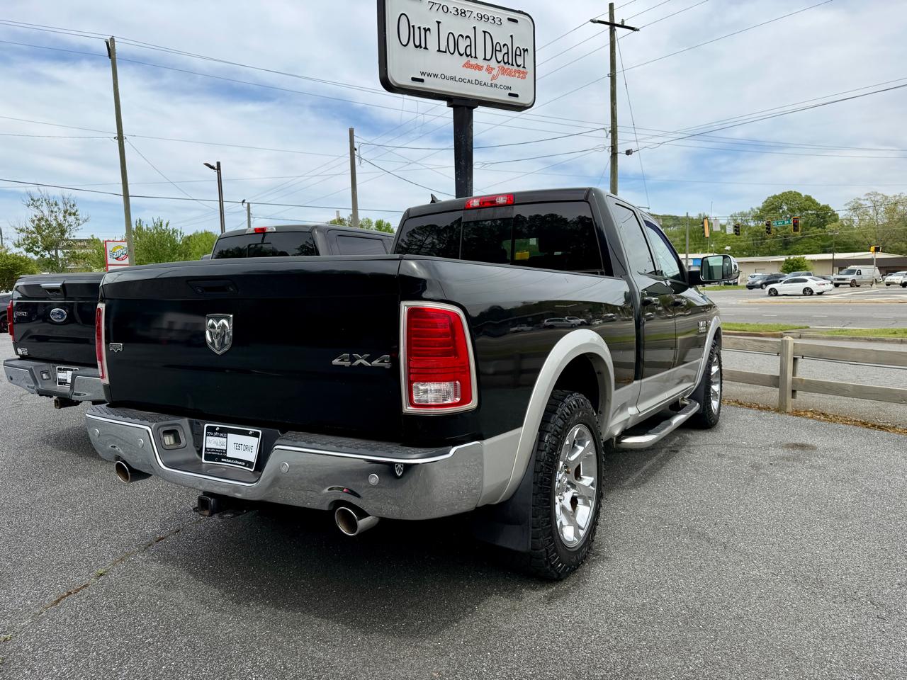 RAM 1500 4WD Quad Cab 140.5" Laramie 2014