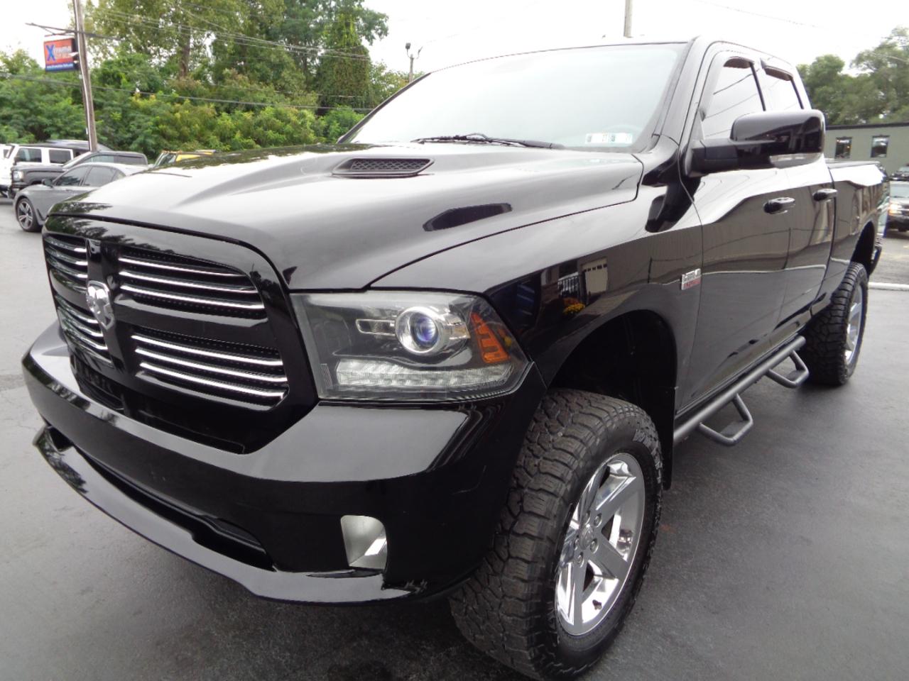 RAM 1500 4WD Quad Cab 140.5" Sport 2014