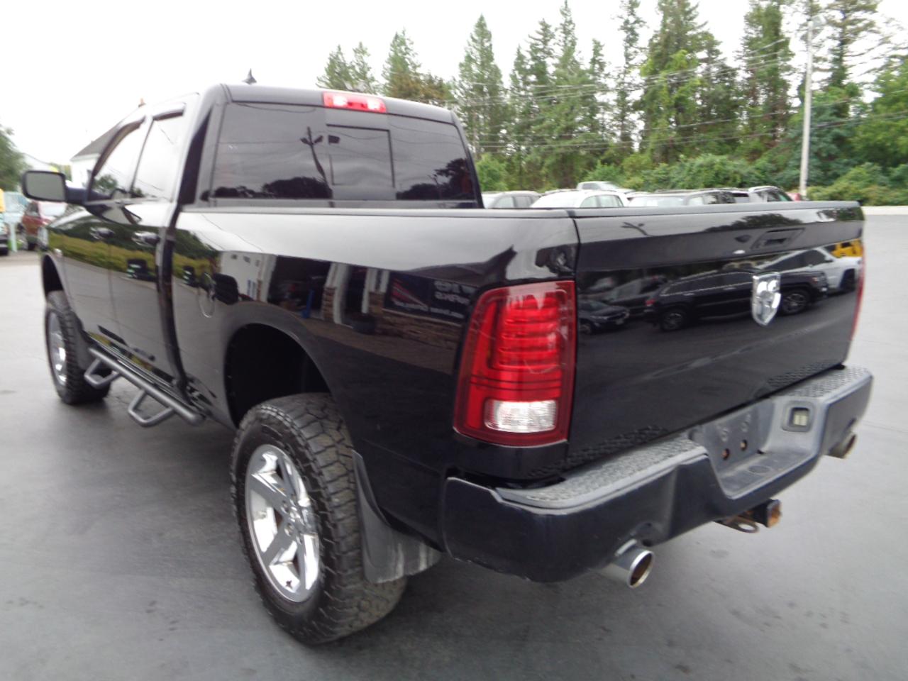 RAM 1500 4WD Quad Cab 140.5" Sport 2014