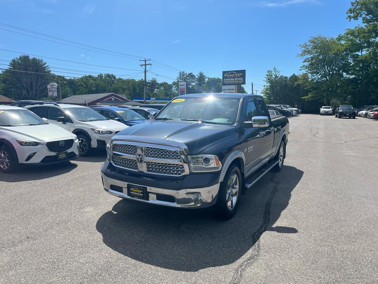 RAM 1500 4WD Quad Cab 140.5" Laramie 2014