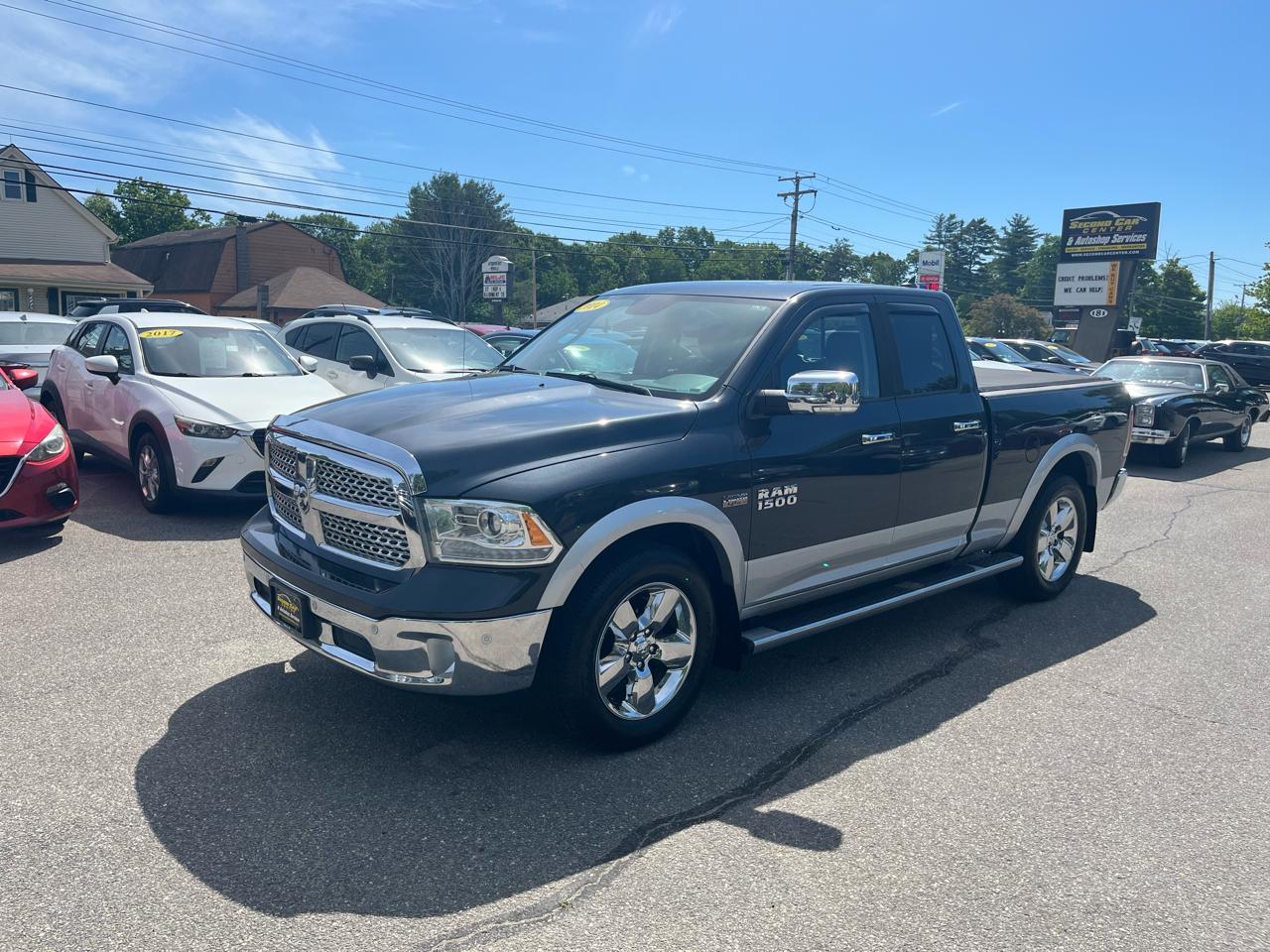 RAM 1500 4WD Quad Cab 140.5" Laramie 2014