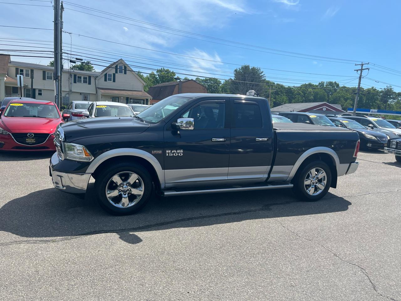 RAM 1500 4WD Quad Cab 140.5" Laramie 2014