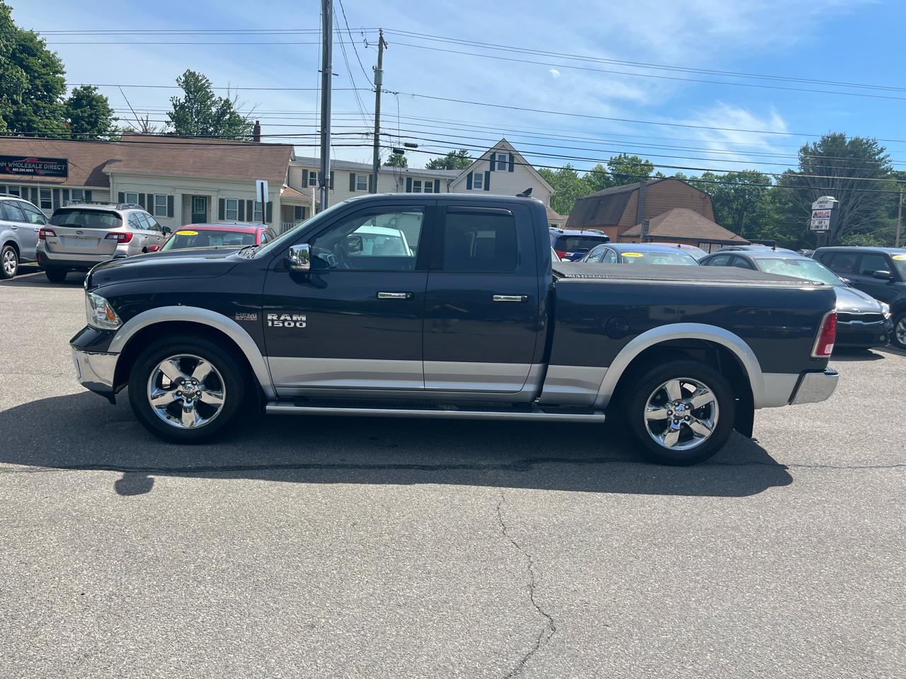 RAM 1500 4WD Quad Cab 140.5" Laramie 2014