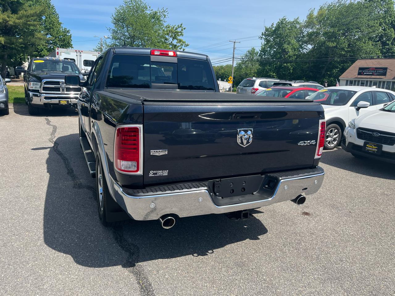 RAM 1500 4WD Quad Cab 140.5" Laramie 2014