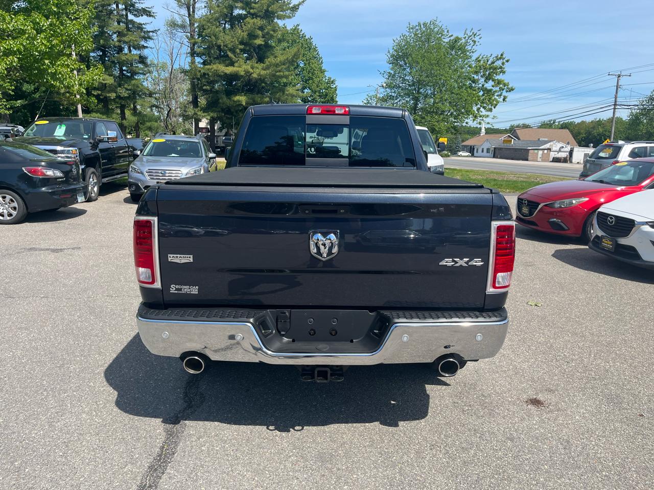 RAM 1500 4WD Quad Cab 140.5" Laramie 2014