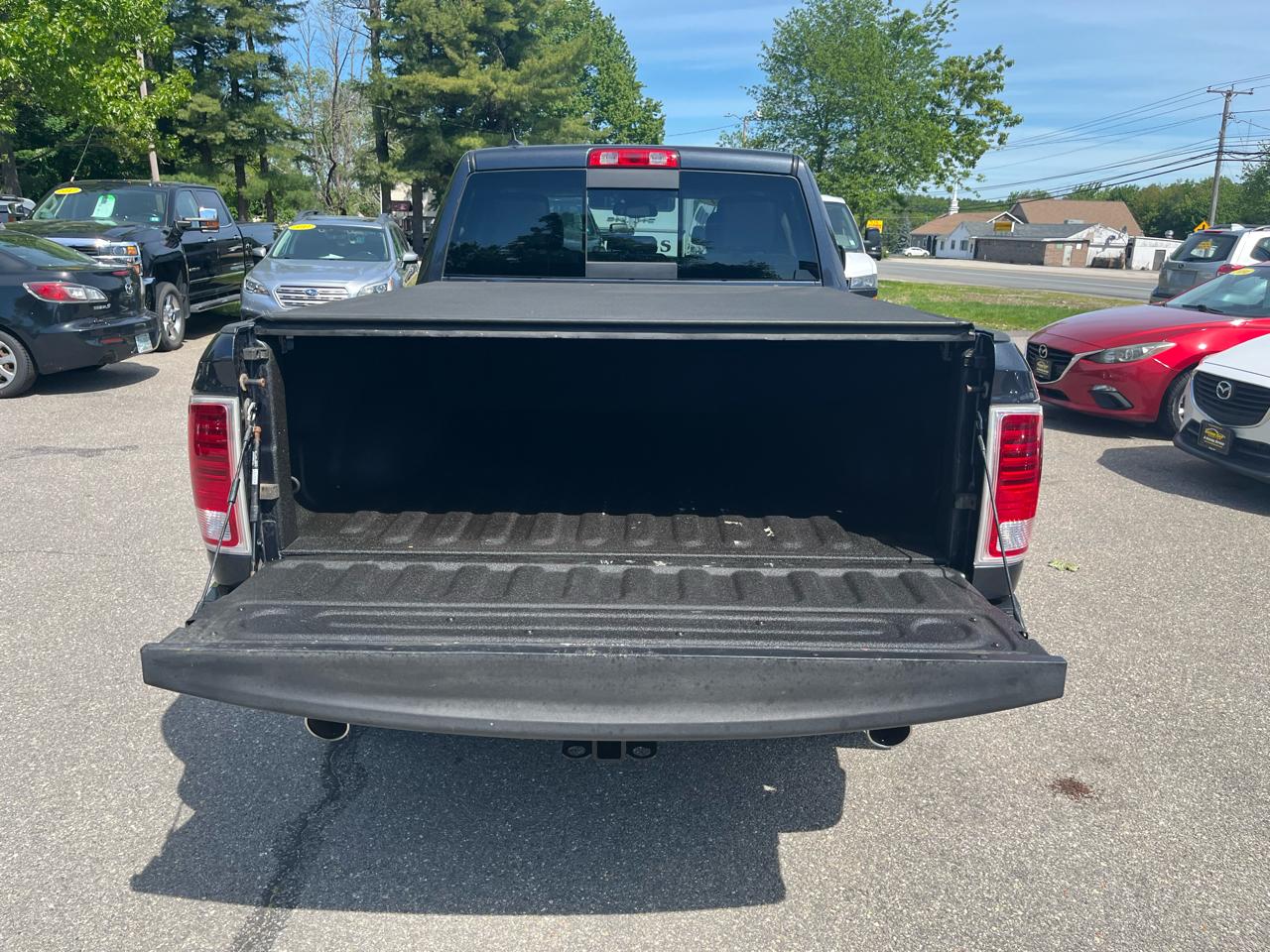 RAM 1500 4WD Quad Cab 140.5" Laramie 2014