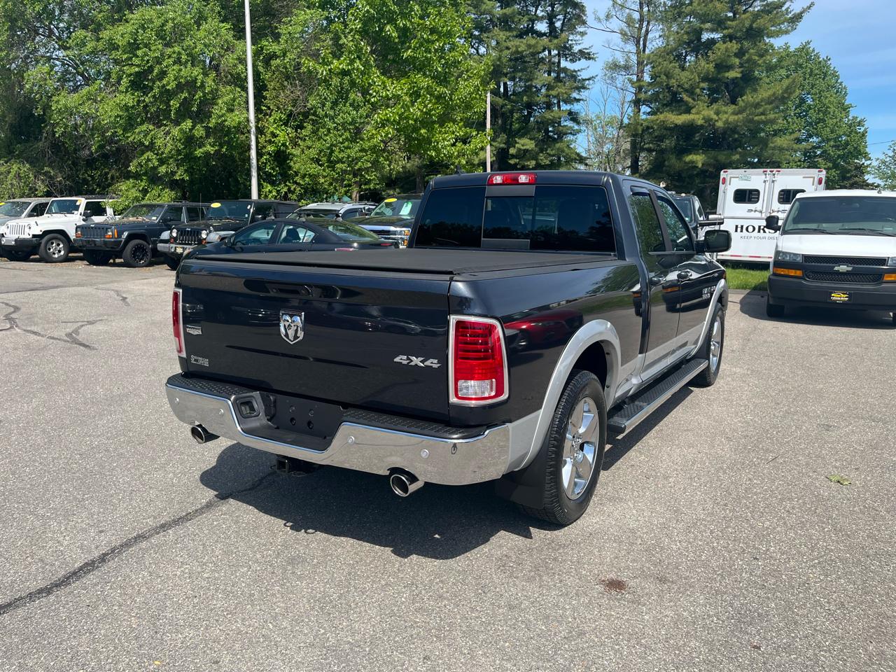 RAM 1500 4WD Quad Cab 140.5" Laramie 2014