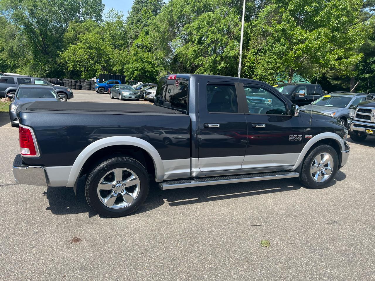 RAM 1500 4WD Quad Cab 140.5" Laramie 2014