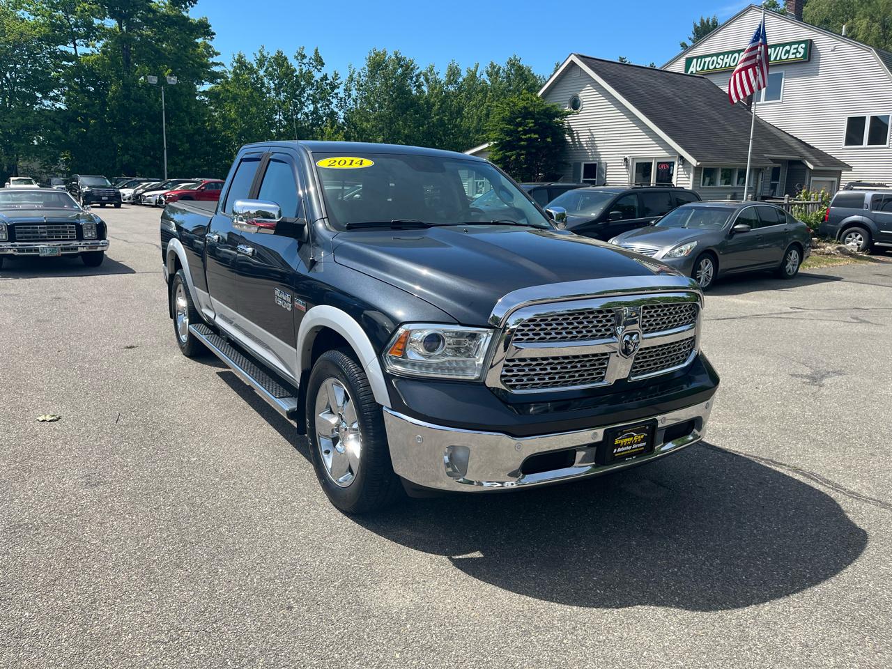 RAM 1500 4WD Quad Cab 140.5" Laramie 2014