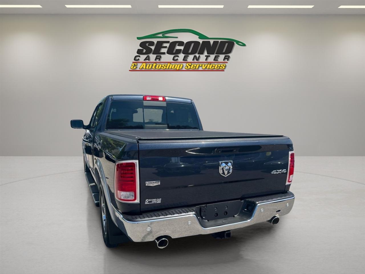 RAM 1500 4WD Quad Cab 140.5" Laramie 2014