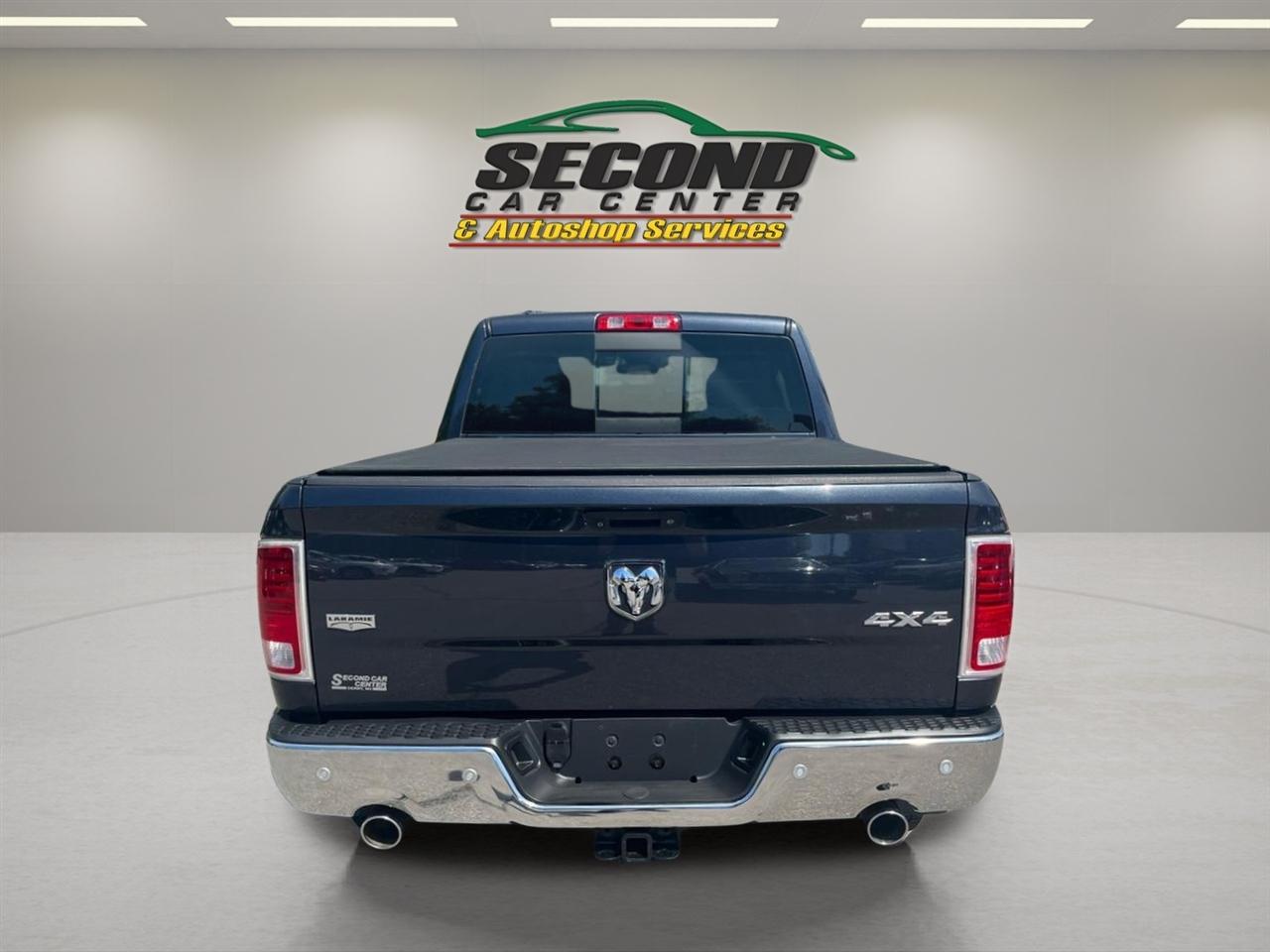 RAM 1500 4WD Quad Cab 140.5" Laramie 2014