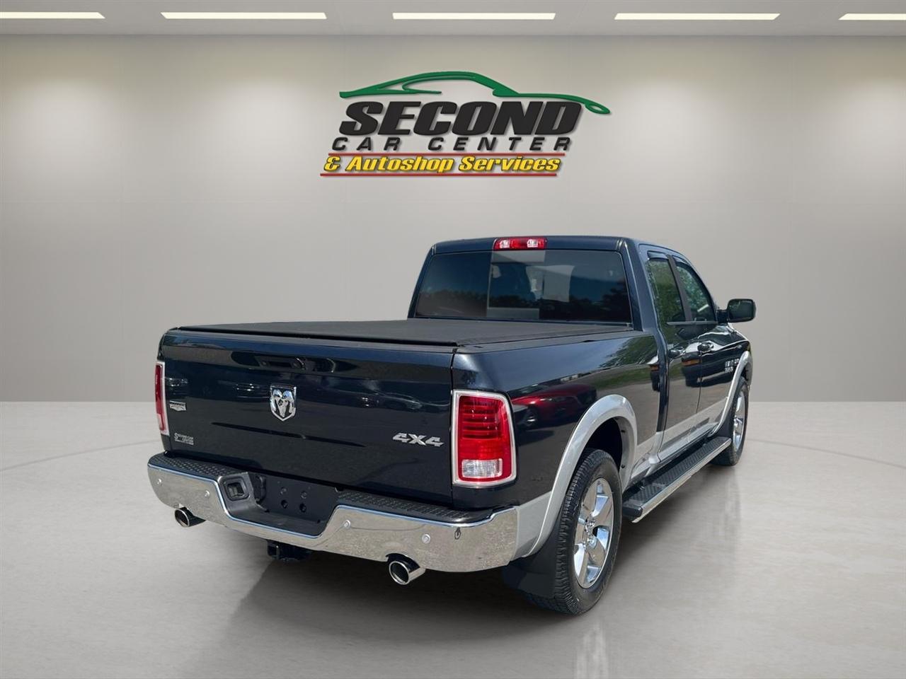 RAM 1500 4WD Quad Cab 140.5" Laramie 2014
