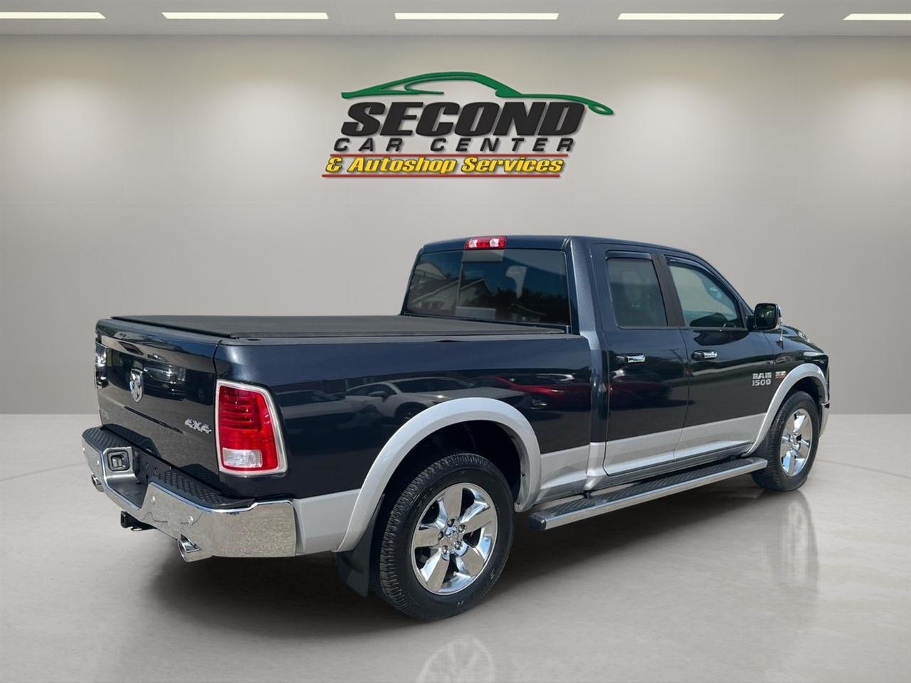 RAM 1500 4WD Quad Cab 140.5" Laramie 2014