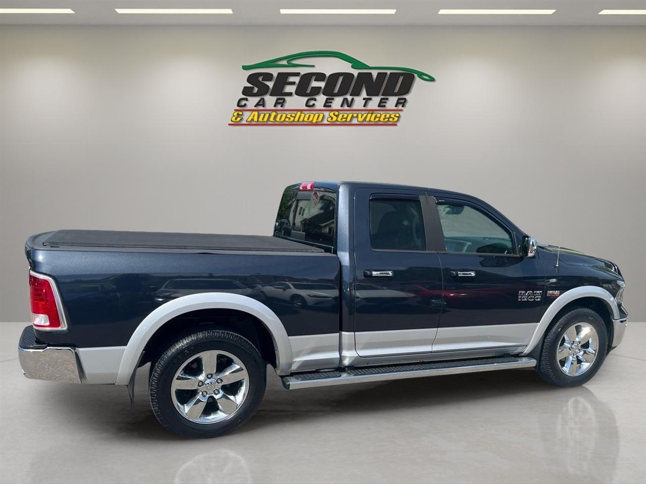 RAM 1500 4WD Quad Cab 140.5" Laramie 2014