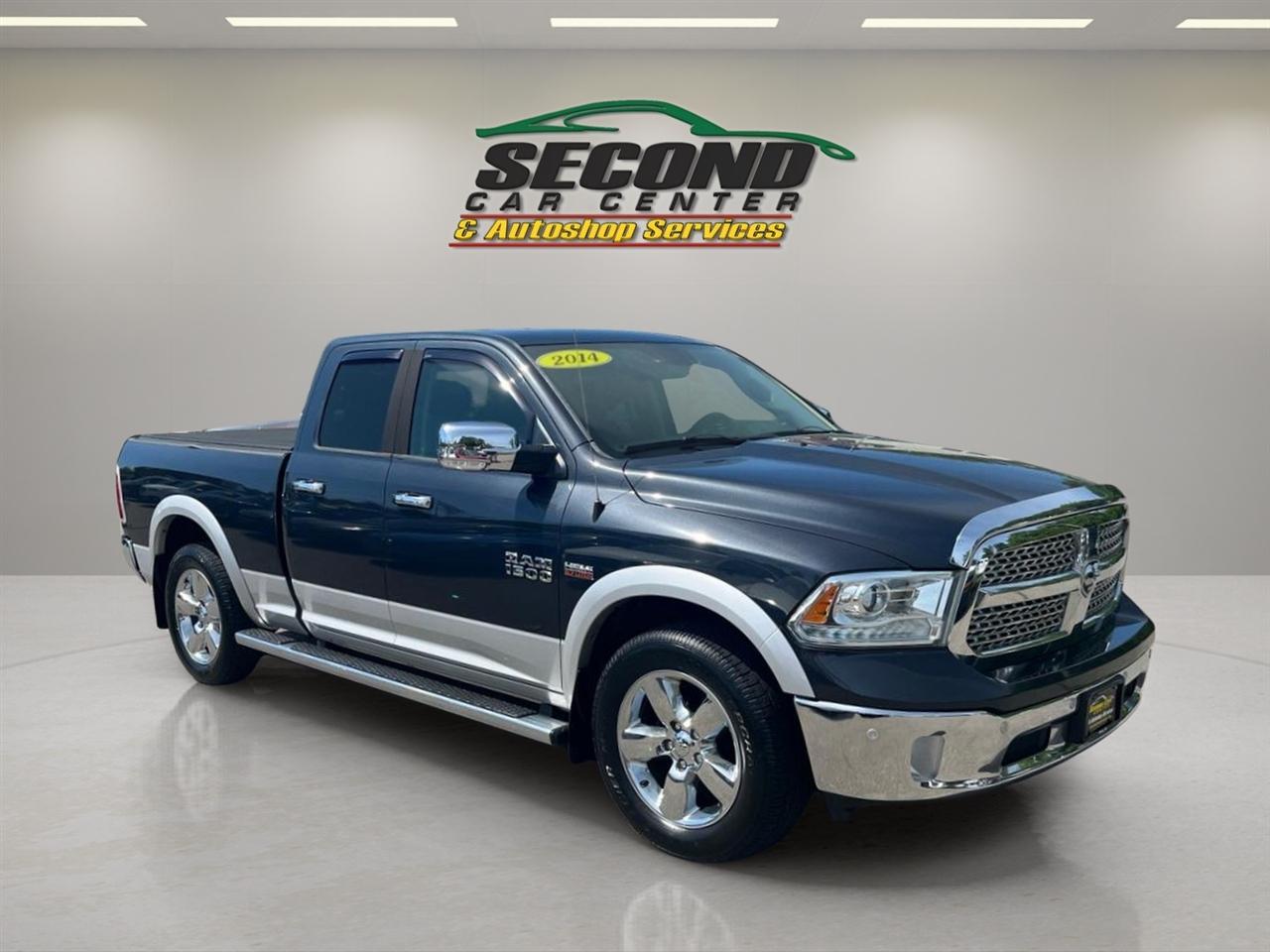 RAM 1500 4WD Quad Cab 140.5" Laramie 2014