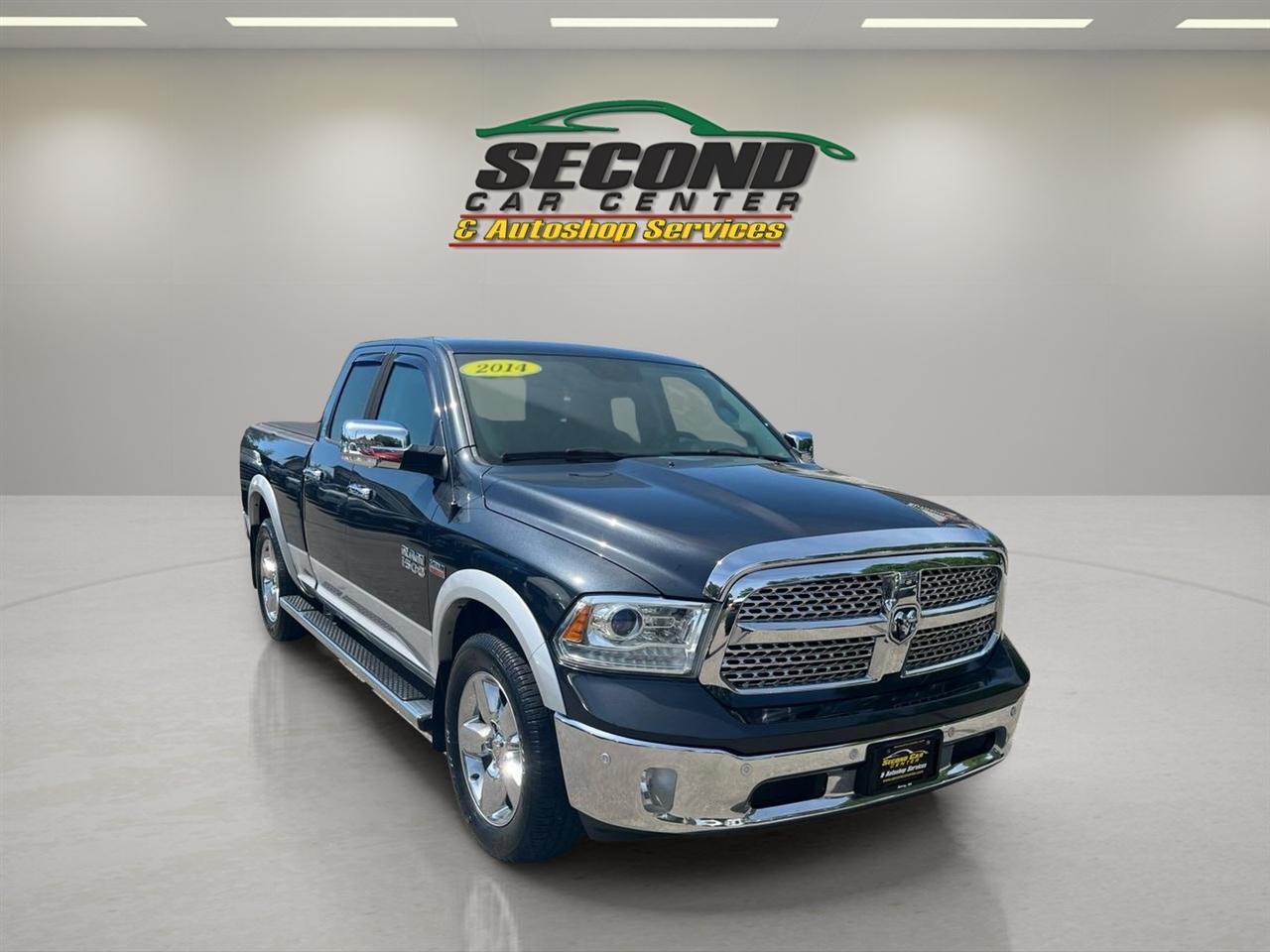 RAM 1500 4WD Quad Cab 140.5" Laramie 2014
