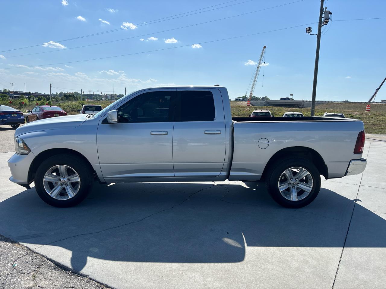 RAM 1500 4WD Quad Cab 140.5" Sport 2014
