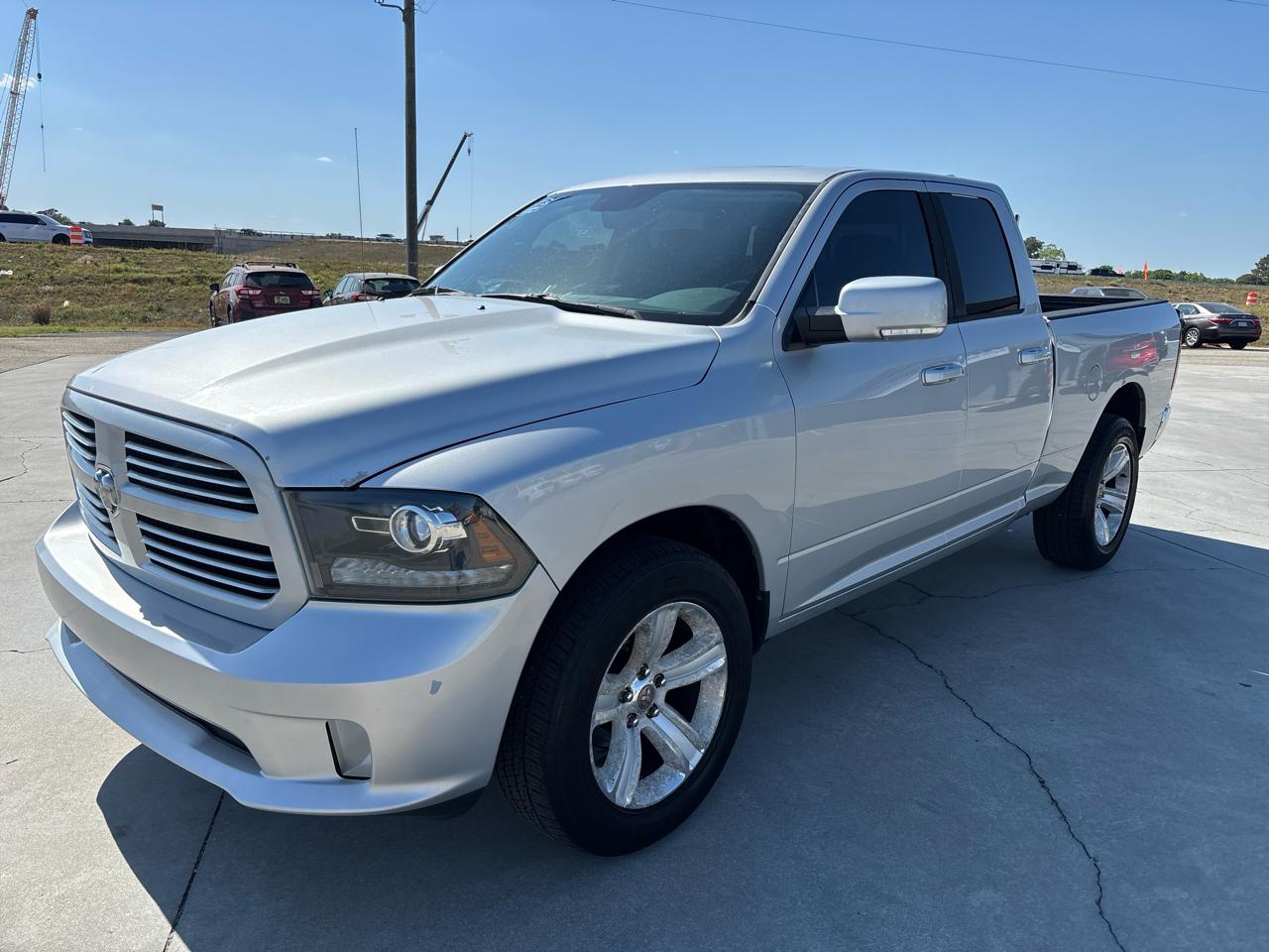 RAM 1500 4WD Quad Cab 140.5" Sport 2014