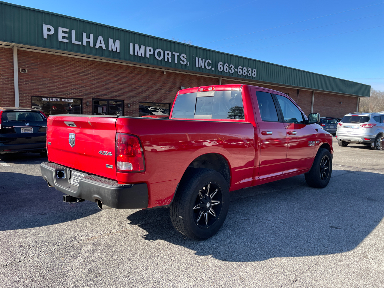 RAM 1500 4WD Quad Cab 140.5" SLT 2016