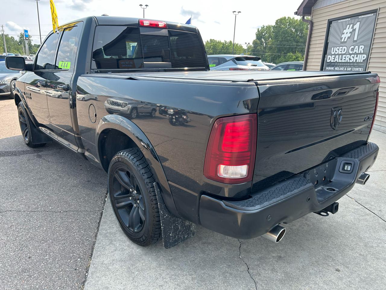 RAM 1500 4WD Quad Cab 140.5" Sport 2016