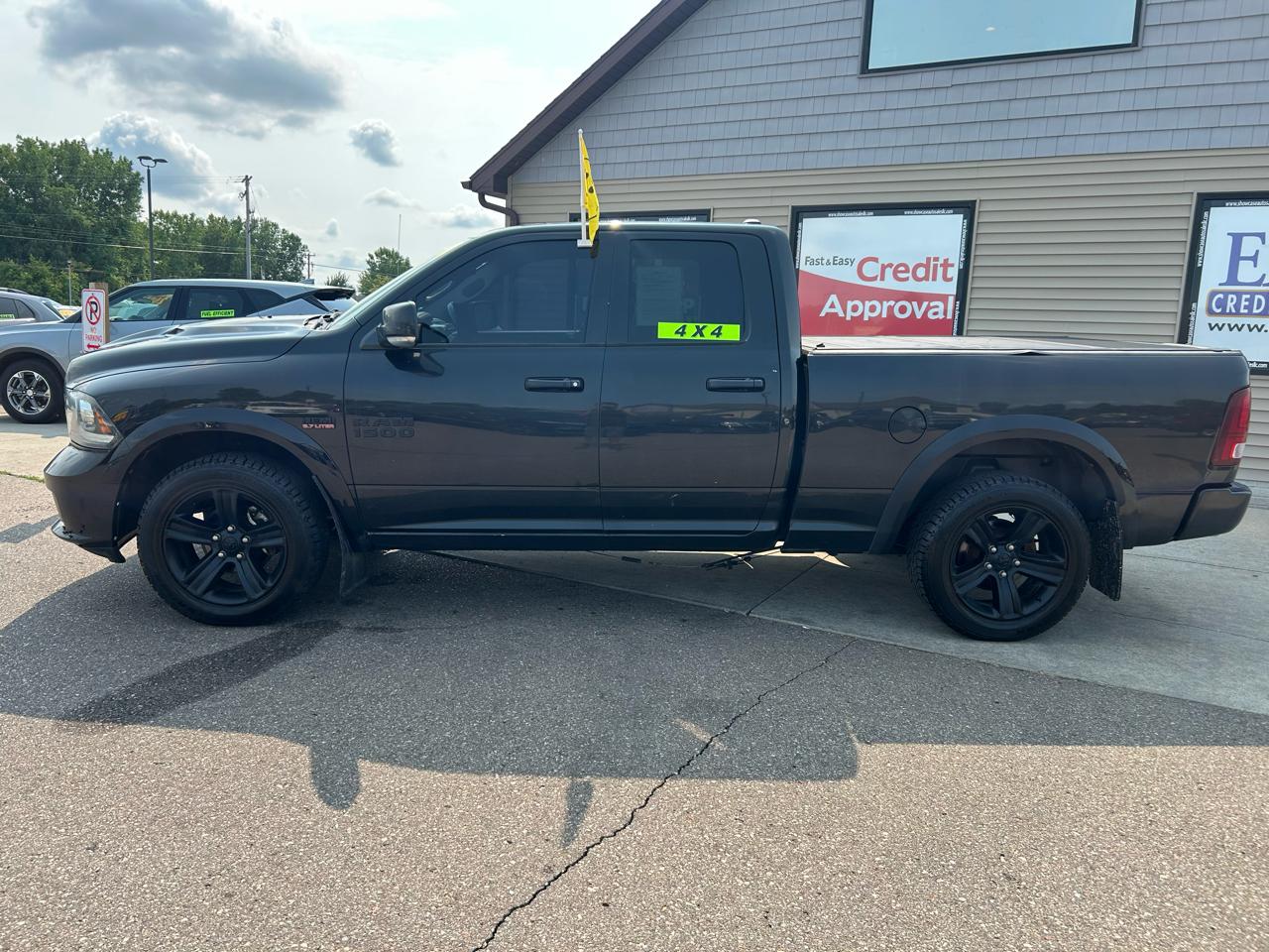 RAM 1500 4WD Quad Cab 140.5" Sport 2016