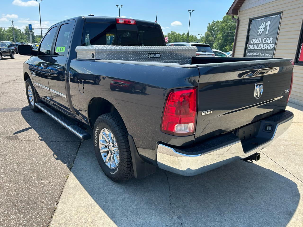 RAM 1500 4WD Quad Cab 140.5" SLT 2016
