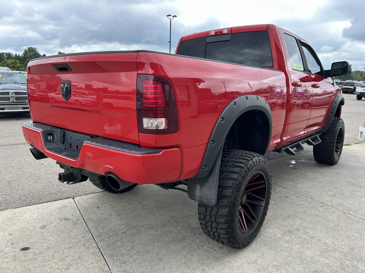 RAM 1500 4WD Quad Cab 140.5" Sport 2016