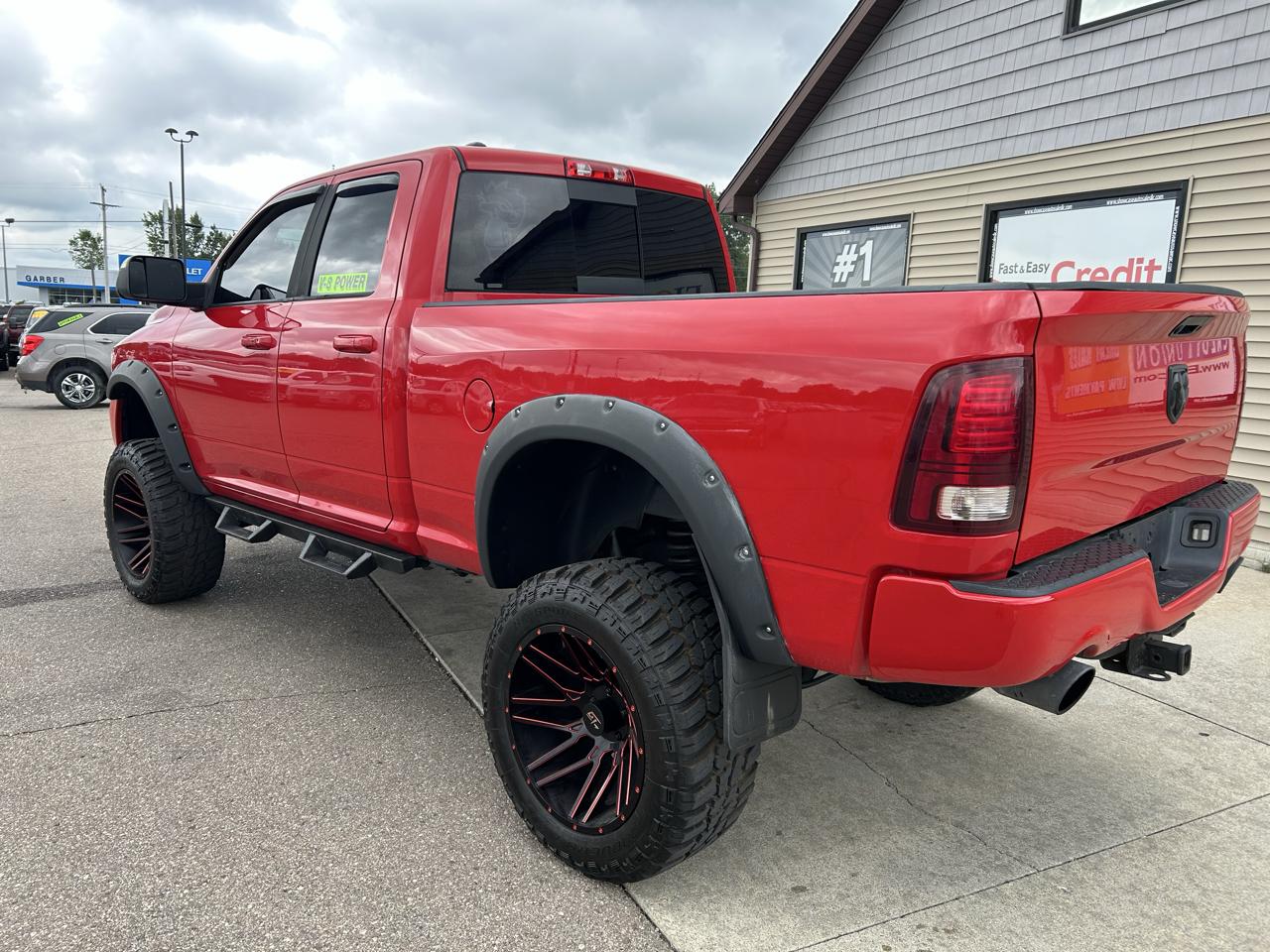 RAM 1500 4WD Quad Cab 140.5" Sport 2016