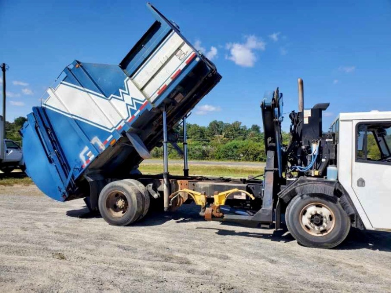 Used 2009 Crane Carrier Co. Low Entry Crane Carrier Trash Truck Side