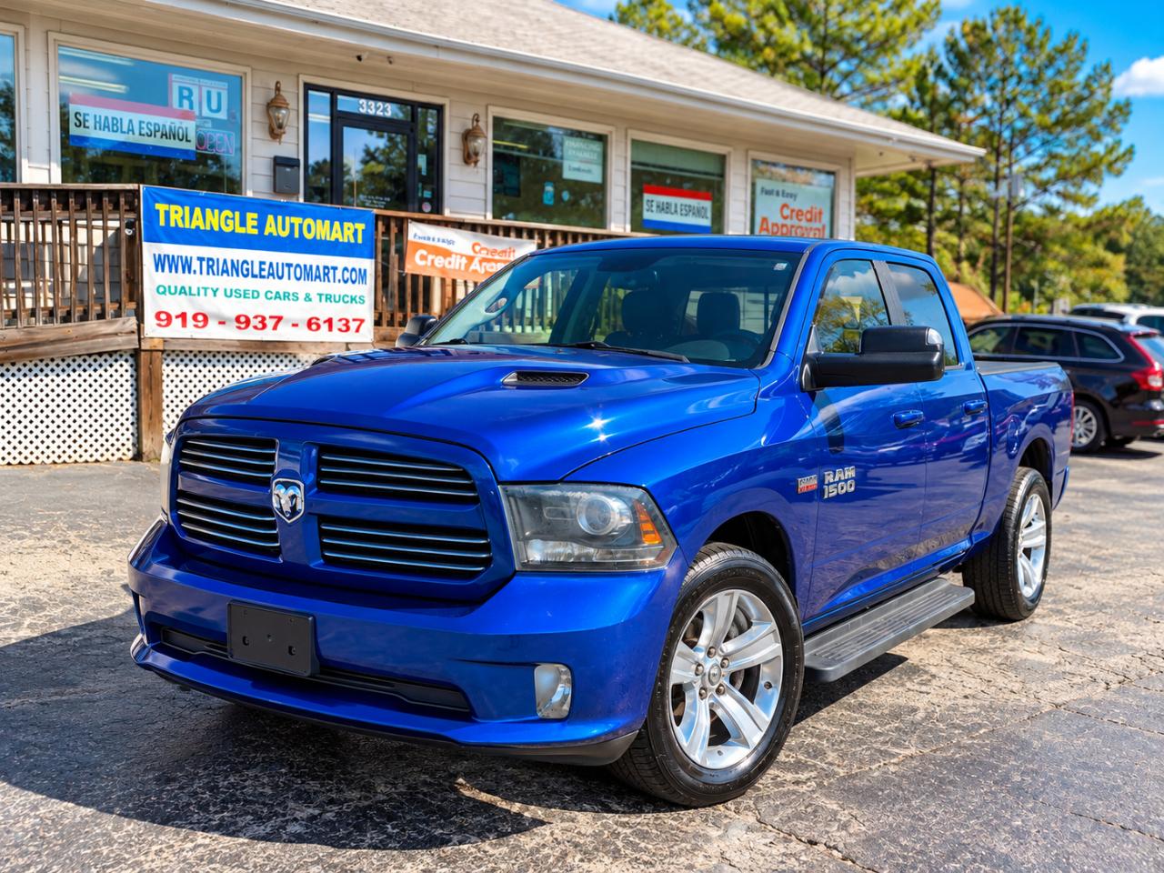 2015 RAM 1500 4WD Crew Cab 140.5" Sport