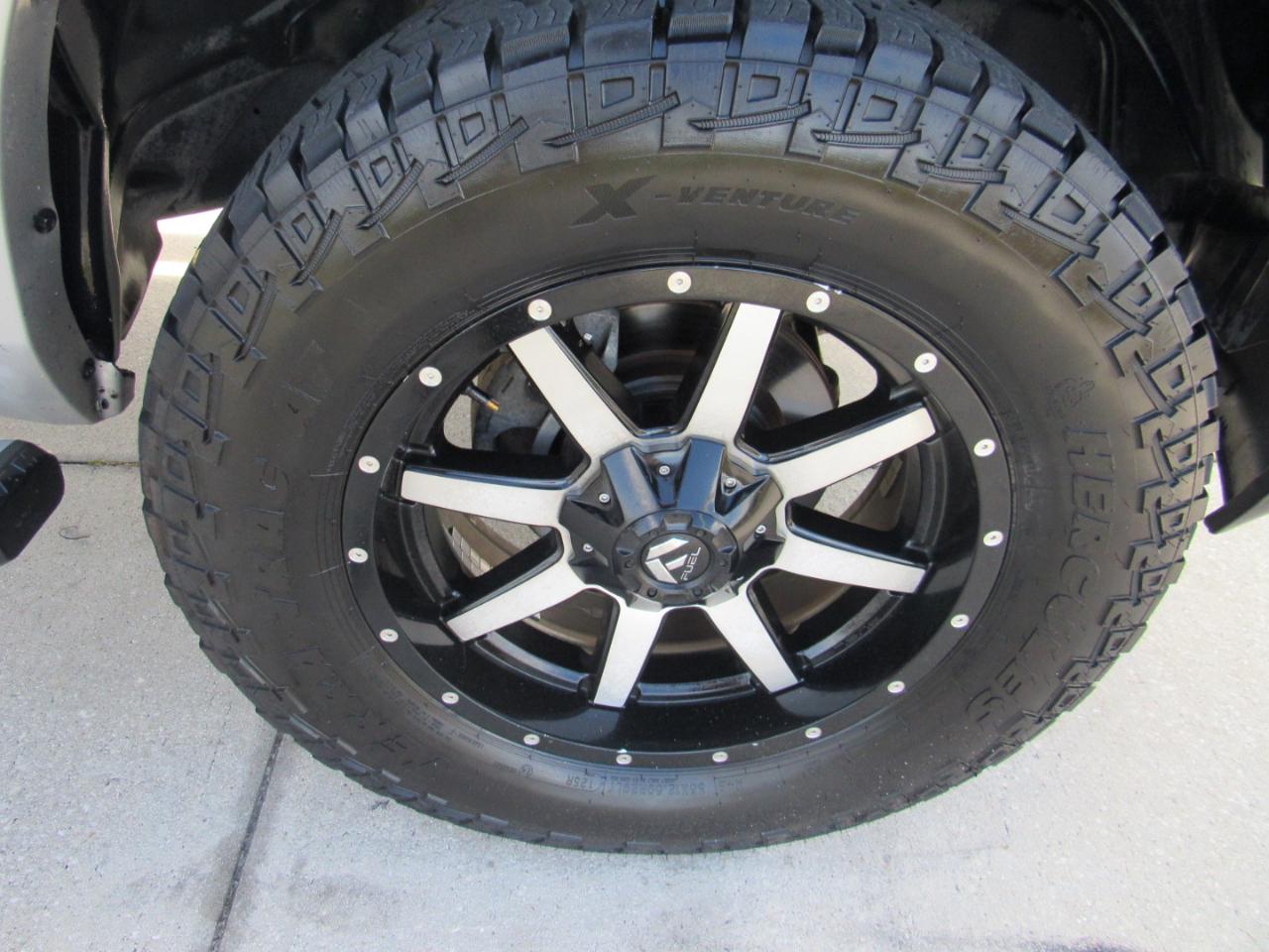 RAM 1500 4WD Quad Cab 140.5" Laramie 2014