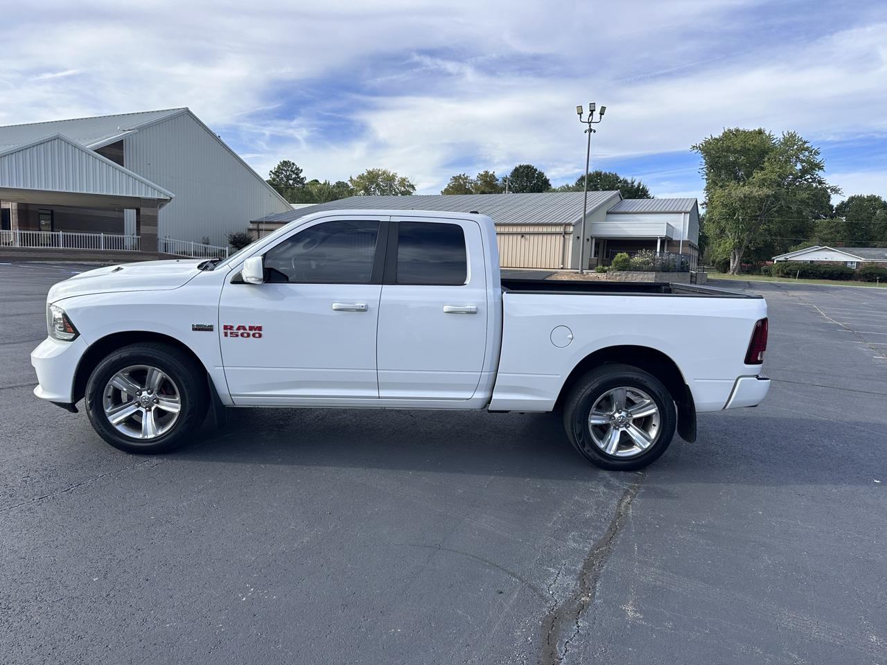 2015 RAM 1500 4WD Quad Cab 140.5" Sport