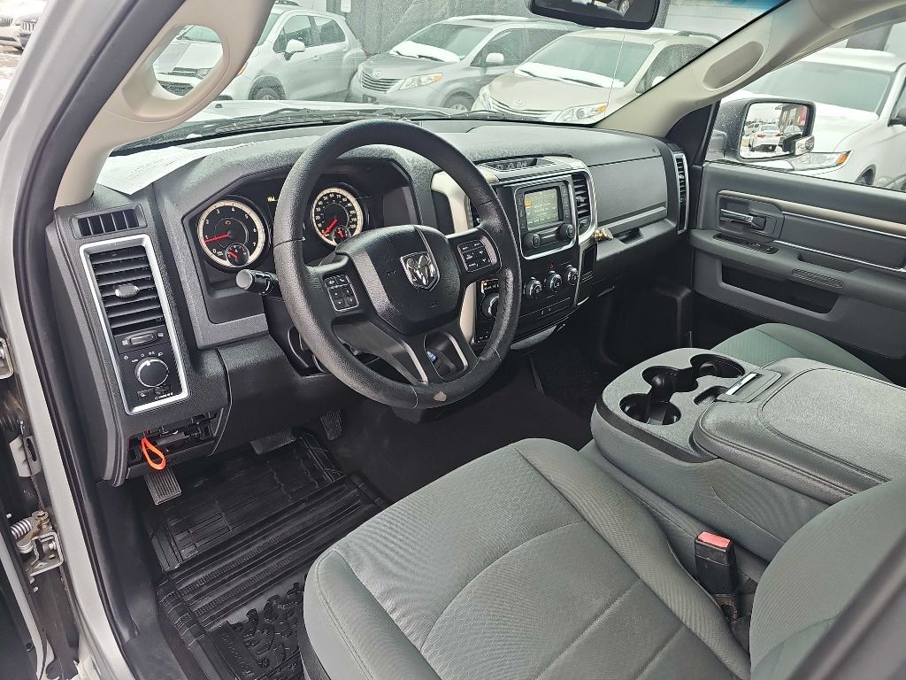 RAM 1500 4WD Quad Cab 140.5" SLT 2016