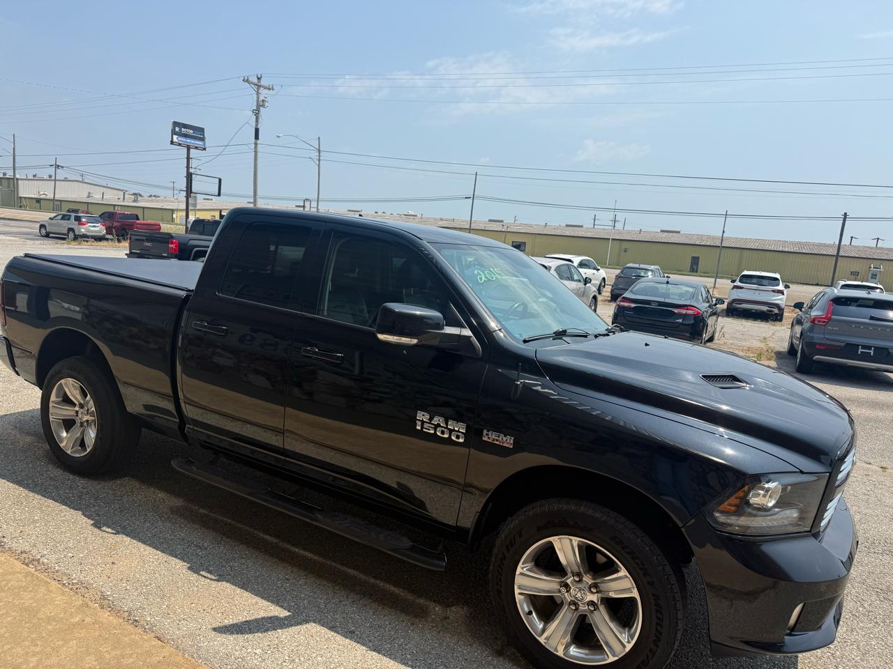 2015 RAM 1500 4WD Quad Cab 140.5" Sport