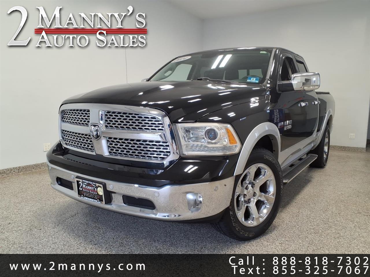 2014 RAM 1500 4WD Quad Cab 140.5" Laramie