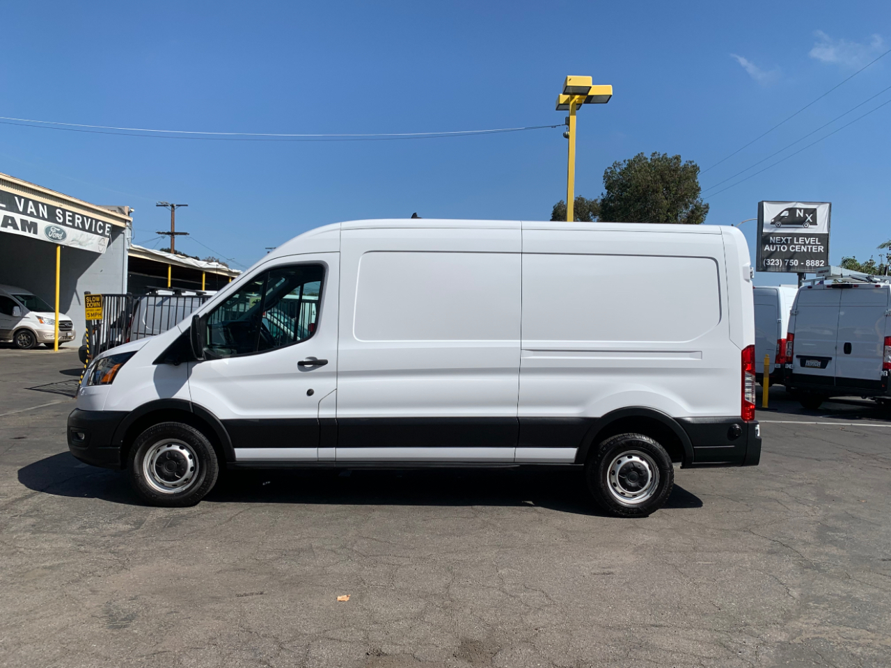 Ford Transit Cargo Van T-150 148" Med Rf 8670 GVWR RWD 2022