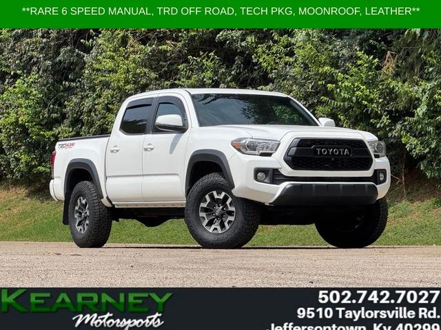 White 2019 Toyota Tacoma Pickup Truck Four-Wheel Drive 6-Speed Manual