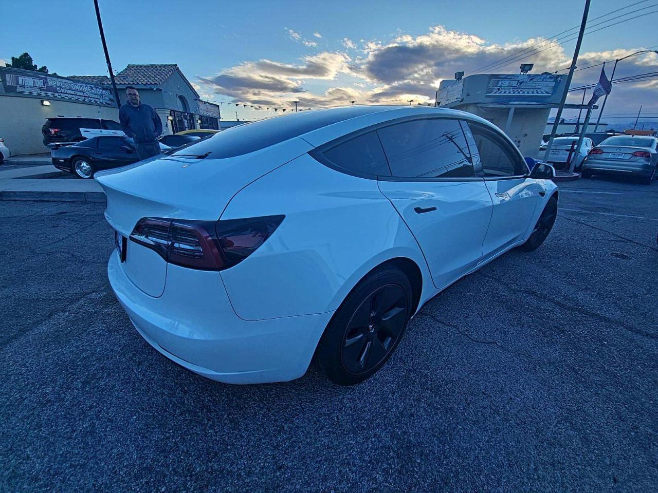 2023 Tesla Model 3 Standard Range Plus 4D Sedan RWD - White exterior view 4