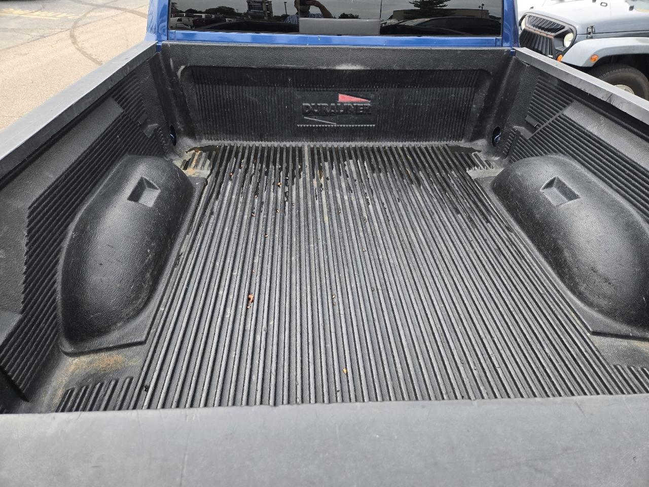 RAM 1500 4WD Quad Cab 140.5" SLT 2011